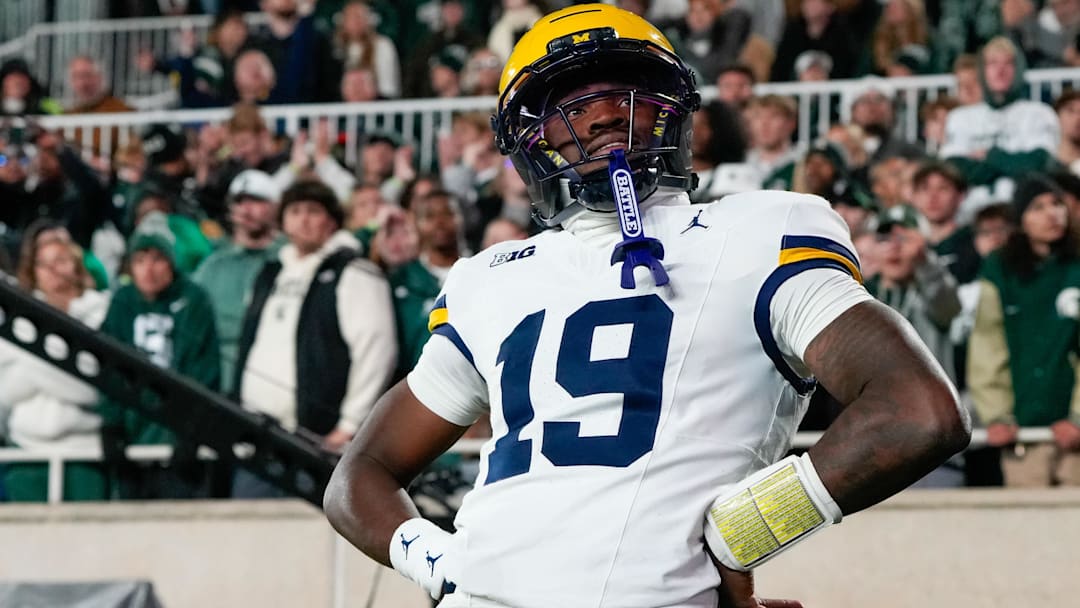 Oct 25, 2025; East Lansing, Michigan, USA; Michigan Wolverines quarterback Bryce Underwood (19) reacts after scoring a touchdown against the Michigan State Spartans during the first half at Spartan Stadium. Mandatory Credit: Brendan Mullin-Imagn Images