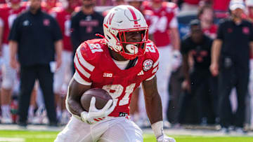 Nebraska Cornhuskers running back Emmett Johnson runs against the Michigan Wolverines.