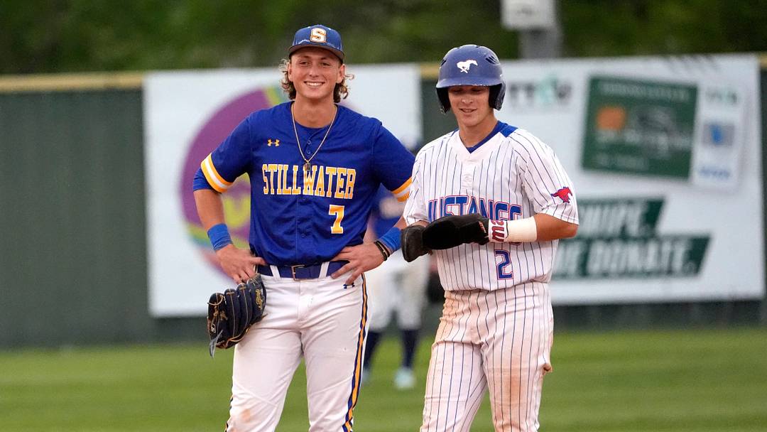 Fort Cobb-Broxton's Eli Willits talks with Stillwater's Ethan Holliday during the high school baseball game between Fort Cobb-Broxton and Stillwater at Edmond Santa Fe High School in Edmond, Okla., Friday, April, 18, 2025.