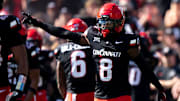 Cincinnati Bearcats cornerback Ormanie Arnold (8) reacts after a defensive stop in the fourth quarter of the NCAA football game between the Cincinnati Bearcats and Iowa State Cyclones at Nippert Stadium in Cincinnati on Oct. 4, 2025.