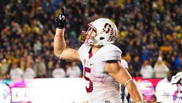 Nov 19, 2016; Berkeley, CA, USA; Stanford Cardinal running back Christian McCaffrey (5) points to the sky in celebration after a touchdown against the California Golden Bears during the fourth quarter at Memorial Stadium. Stanford defeated California 45-31. Mandatory Credit: Kelley L Cox-Imagn Images