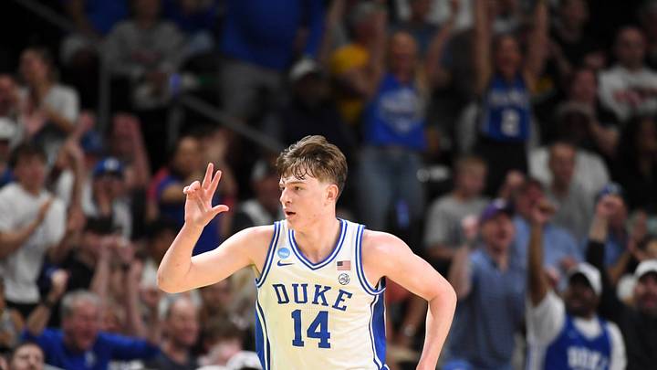 Duke Blue Devils guard Nikolas Khamenia (14) celebrates after scoring Saturday, March 21, 2026, during the NCAA Men’s Basketball Tournament second round game against the TCU Horned Frogs at Bon Secours Wellness Arena in Greenville, South Carolina.