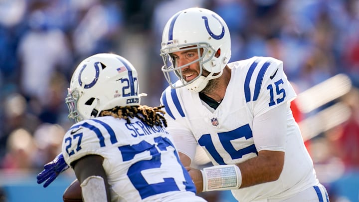 The Colts' Joe Flacco hands the ball off to Trey Sermon. The Colts' Joe Flacco hands the ball off to Trey Sermon.