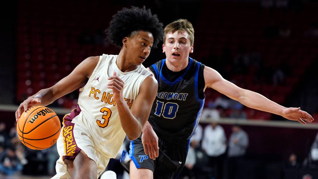 Putnam City North's Keaton Murry dribbles beside Piedmont's Carter Hainrihar during the Class 6A boys basketball state quarterfinal game between Putnam City North and Piedmont at Lloyd Noble Center in Norman, Okla., Wednesday, March 11, 2026. Putnam City North's Keaton Murry dribbles beside Piedmont's Carter Hainrihar during the Class 6A boys basketball state quarterfinal game between Putnam City North and Piedmont at Lloyd Noble Center in Norman, Okla., Wednesday, March 11, 2026.