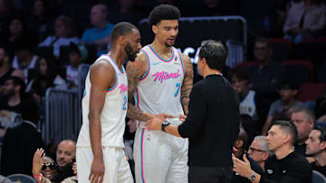 Mar 8, 2025; Miami, Florida, USA; Miami Heat head coach Erik Spoelstra talks to center Kel'el Ware (7) and forward Andrew Wiggins (22) against the Chicago Bulls during the third quarter at Kaseya Center. Mandatory Credit: Sam Navarro-Imagn Images
