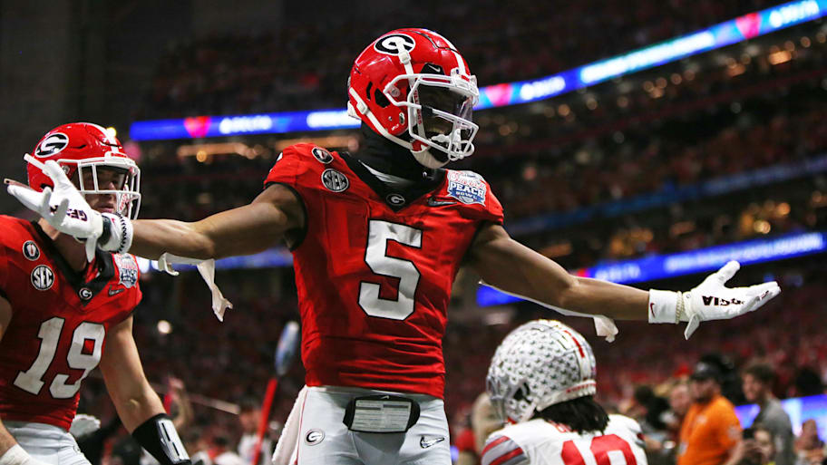 Georgia Bulldogs wide receiver Adonai Mitchell celebrates after catching a touchdown against the Ohio State Buckeyes.