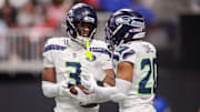 Dec 7, 2025; Atlanta, Georgia, USA; Seattle Seahawks safety Nick Emmanwori (3) celebrates after an interception with safety Julian Love (20) against the Atlanta Falcons in the third quarter at Mercedes-Benz Stadium.