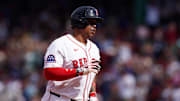Rafael Devers circles the bases after a home run against the Rangers.