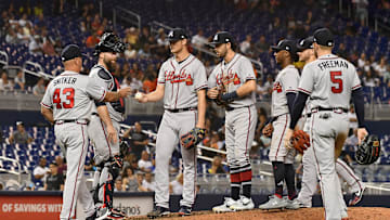 Jun 7, 2019; Miami, FL, USA; Atlanta Braves manager Brian Snitker (43) takes the ball from starting pitcher Mike Soroka (40) in the ninth inning against the Miami Marlins at Marlins Park. Mandatory Credit: Jasen Vinlove-Imagn Images