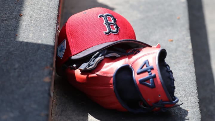 Mar 15, 2019; Tampa, FL, USA; Boston Red Sox hat and glove lay in the dugout  at George M. Steinbrenner Field. Mandatory Credit: Kim Klement-USA TODAY Sports