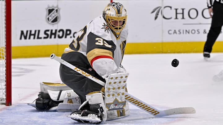 Jan 24, 2025; Dallas, Texas, USA; Vegas Golden Knights goaltender Adin Hill (33) makes a save on a Dallas Stars shot during the second period at the American Airlines Center. Mandatory Credit: Jerome Miron-Imagn Images