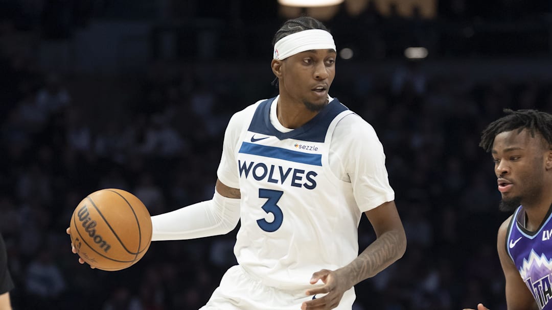Mar 18, 2026; Minneapolis, Minnesota, USA; Minnesota Timberwolves forward Jaden McDaniels (3) dribbles the ball against the Utah Jazz in the first half at Target Center. Mandatory Credit: Jesse Johnson-Imagn Images