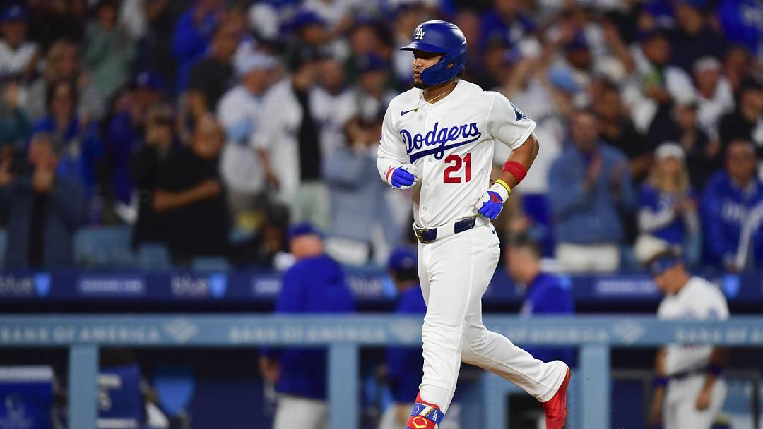 May 13, 2026; Los Angeles, California, USA; Los Angeles Dodgers third baseman Santiago Espinal (21) hits a solo home run in the third inning against the San Francisco Giants at Dodger Stadium. Mandatory Credit: Gary A. Vasquez-Imagn Images