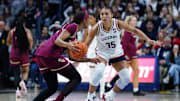 Nov 9, 2025; Storrs, Connecticut, USA; UConn Huskies guard Azzi Fudd (35) defends against Florida State Seminoles guard Sydney Bowles (11) in the second half at Harry A. Gampel Pavilion. Mandatory Credit: David Butler II-Imagn Images