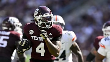 Sep 27, 2025; College Station, Texas, USA; Texas A&M Aggies running back Rueben Owens II (4) runs the ball during the first half against the Auburn Tigers at Kyle Field. Mandatory Credit: Maria Lysaker-Imagn Images 