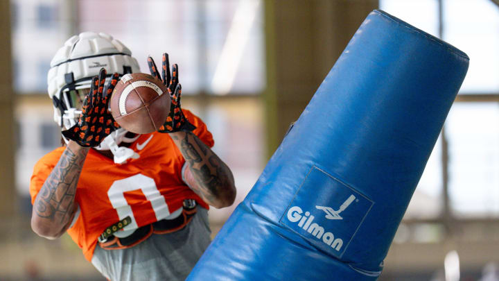 Ollie Gordon II (0) runs drills during an Oklahoma State football practice