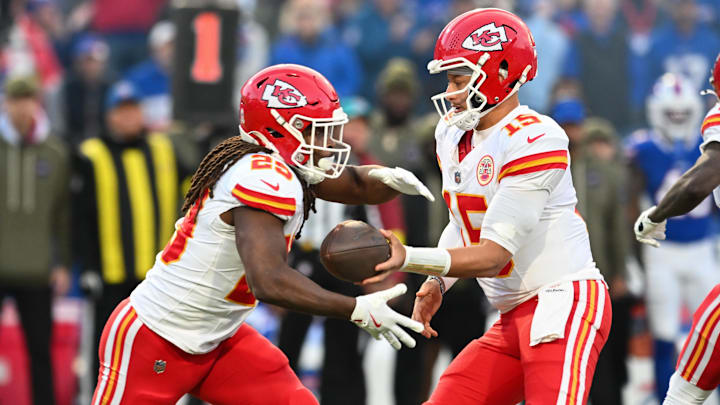 Nov 2, 2025; Orchard Park, New York, USA; Kansas City Chiefs quarterback Patrick Mahomes (15) hands the ball off to running back Elijah Mitchell (25) in the first quarter against the Buffalo Bills at Highmark Stadium.
