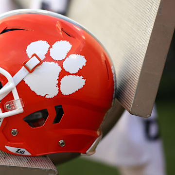 A Clemson Tigers helmet sits on the bench