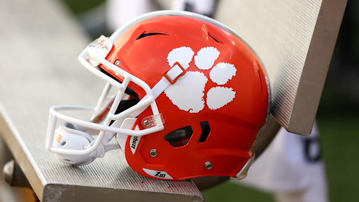 A Clemson Tigers helmet sits on the bench