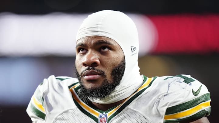 Dec 14, 2025; Denver, Colorado, USA; Green Bay Packers defensive end Micah Parsons (1) walks off the field with help from medical personnel following an injury during the third quarter against the Denver Broncos at Empower Field at Mile High. Mandatory Credit: Ron Chenoy-Imagn Images