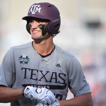 Texas A&M's Jace LaViolette (17) smiles during Game 3 of the NCAA College World Series finals between Tennessee and Texas A&M at Charles Schwab Field in Omaha, Neb., on Monday, June 24, 2024.
