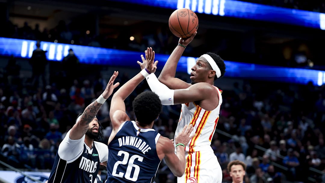 Apr 2, 2025; Dallas, Texas, USA; Atlanta Hawks forward Onyeka Okongwu (17) shoots over Dallas Mavericks forward Anthony Davis (3) and Dallas Mavericks guard Spencer Dinwiddie (26) during the fourth quarter at American Airlines Center. Mandatory Credit: Kevin Jairaj-Imagn Images
