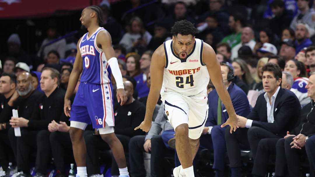 Jan 5, 2026; Philadelphia, Pennsylvania, USA; Denver Nuggets guard Jalen Pickett (24) reacts to his three pointer in front of Philadelphia 76ers guard Tyrese Maxey (0) during the second quarter at Xfinity Mobile Arena. Mandatory Credit: Bill Streicher-Imagn Images