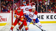 Mar 8, 2025; Calgary, Alberta, CAN; Calgary Flames center Nazem Kadri (91) and Montreal Canadiens defenseman Mike Matheson (8) fights for position in front of Montreal Canadiens goaltender Jakub Dobes (75) during the second period at Scotiabank Saddledome. Mandatory Credit: Sergei Belski-Imagn Images