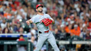 May 9, 2025; Houston, Texas, USA; HCincinnati Reds pitcher Nick Martinez (28) throws a fielded ball to first base for an out against the Houston Astros during the fourth inning at Daikin Park. Mandatory Credit: Erik Williams-Imagn Images