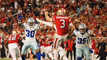 Oct 27, 2024; Santa Clara, California, USA; San Francisco 49ers punter Mitch Wishnowsky (3) punts the ball against Dallas Cowboys safety Juanyeh Thomas (30) and linebacker Marist Liufau (35) during the fourth quarter at Levi's Stadium. Mandatory Credit: Kelley L Cox-Imagn Images
