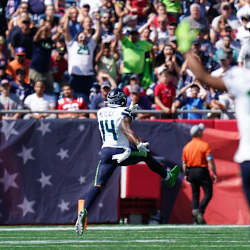 Sep 15, 2024; Foxborough, Massachusetts, USA; Seattle Seahawks wide receiver DK Metcalf (14) scores a touchdown against the New England Patriots in the first quarter at Gillette Stadium. Mandatory Credit: David Butler II-Imagn Images