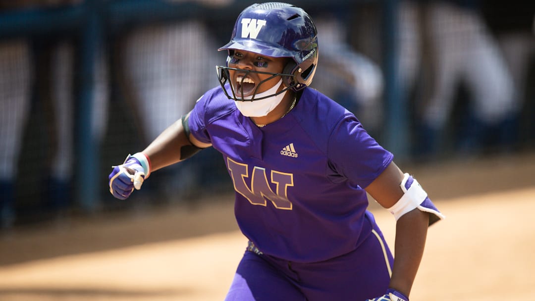 AUSL All-Star Cup pitcher and Team Kilfoyl member Sarah Willis  celebrates her solo homerun while playing for Washington during an NCAA D1 softball game against the UCLA Bruins at Easton Stadium on April 25, 2021 in Los Angeles.