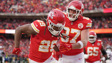 Kansas City Chiefs running back Kareem Hunt (29) celebrates with tight end Travis Kelce (87) after scoring a touchdown against the Houston Texans during the first half of a 2025 AFC divisional round game at GEHA Field at Arrowhead Stadium.