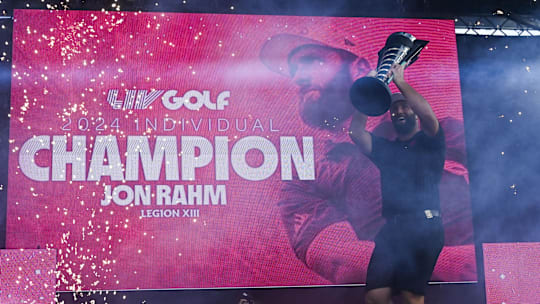 Jon Rahm of the Legion XIII  holds the individual trophy after winning the LIV Golf Chicago tournament at Bolingbrook Golf Club.