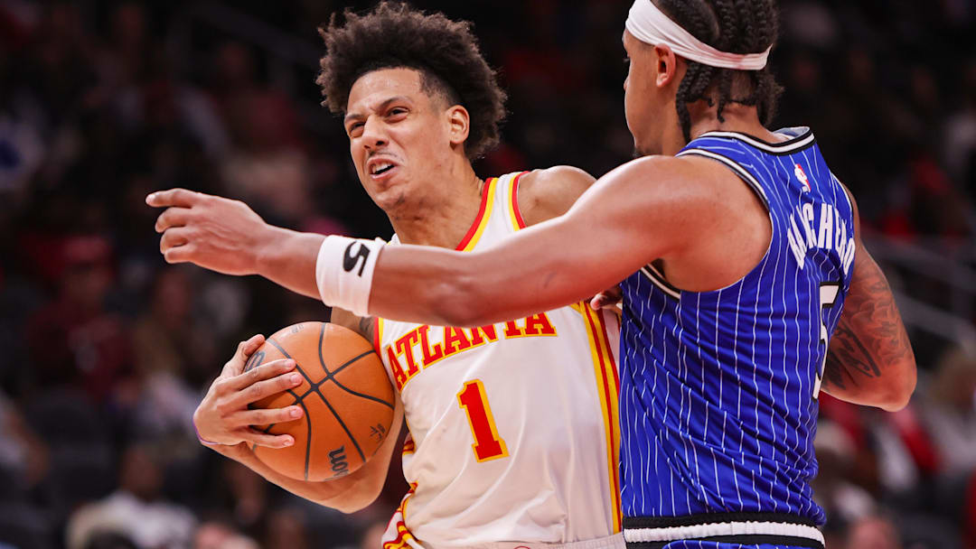 Nov 4, 2025; Atlanta, Georgia, USA; Atlanta Hawks forward Jalen Johnson (1) is defended by Orlando Magic forward Paolo Banchero (5) in the third quarter at State Farm Arena. Mandatory Credit: Brett Davis-Imagn Images
