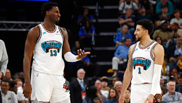 Apr 18, 2025; Memphis, Tennessee, USA; Memphis Grizzlies forward Jaren Jackson Jr. (13) reacts with guard Scotty Pippen Jr. (1) during the fourth quarter against the Dallas Mavericks at FedExForum. Mandatory Credit: Petre Thomas-Imagn Images