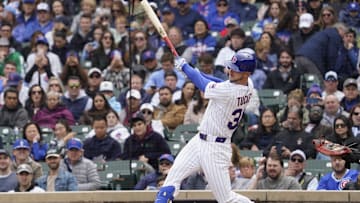 Chicago Cubs outfielder Kyle Tucker (30) hits a one run triple against the Arizona Diamondbacks during the first inning at Wrigley Field on April 19.