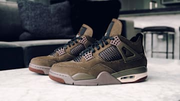 The A Ma Maniére x Air Jordan 4 "Dark Mocha" colorway.