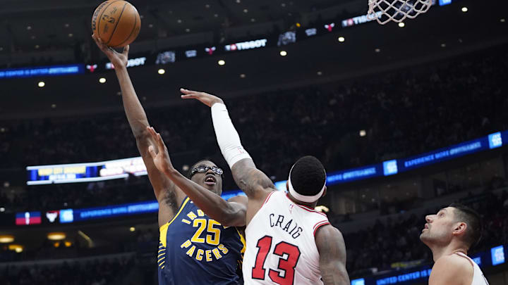 Mar 27, 2024; Chicago, Illinois, USA; Indiana Pacers forward Jalen Smith (25) shoots over Chicago Bulls forward Torrey Craig (13): David Banks-USA TODAY Sports