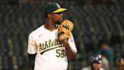 Jun 19, 2024; Oakland, California, USA; Oakland Athletics relief pitcher Dany Jimenez (56) on the mound against the Kansas City Royals during the seventh inning at Oakland-Alameda County Coliseum. Mandatory Credit: Kelley L Cox-Imagn Images