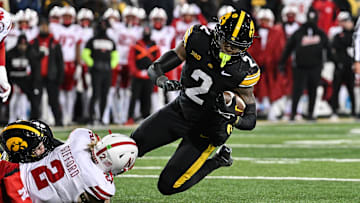 Iowa running back Kaleb Johnson is tackled by Nebraska's Isaac Gifford during the third quarter.