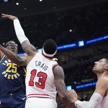 Mar 27, 2024; Chicago, Illinois, USA; Indiana Pacers forward Jalen Smith (25) shoots over Chicago Bulls forward Torrey Craig (13) during the first quarter at United Center. Mandatory Credit: David Banks-USA TODAY Sports