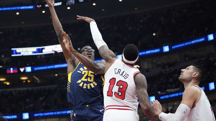 Mar 27, 2024; Chicago, Illinois, USA; Indiana Pacers forward Jalen Smith (25) shoots over Chicago Bulls forward Torrey Craig (13) during the first quarter at United Center. Mandatory Credit: David Banks-USA TODAY Sports