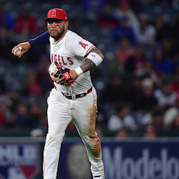 May 6, 2025; Anaheim, California, USA; Los Angeles Angels third baseman Yoan Moncada (5) throws to first for the out against Toronto Blue Jays center fielder Daulton Varsho (5) during the sixth inning at Angel Stadium. Mandatory Credit: Gary A. Vasquez-Imagn Images
