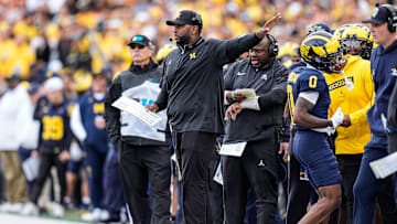 Michigan head coach Sherrone Moore calls a play against Texas during the first half at Michigan Stadium in Ann Arbor on Saturday, September 7, 2024.