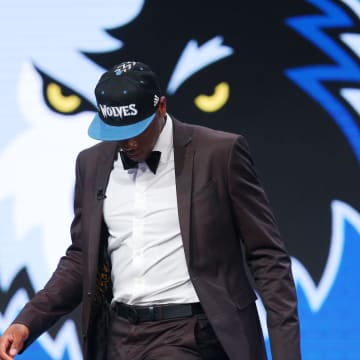 Jun 23, 2016; New York, NY, USA; Kris Dunn (Providence) walks off the stage after being selected as the number five overall pick to the Minnesota Timberwolves in the first round of the 2016 NBA Draft at Barclays Center. Mandatory Credit: Brad Penner-USA TODAY Sports