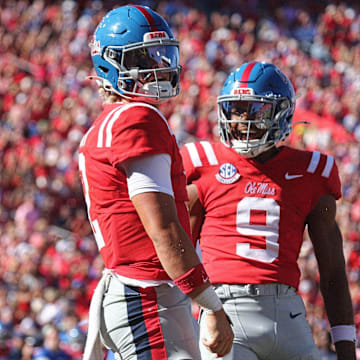 Sep 7, 2024; Oxford, Mississippi, USA; Mississippi Rebels quarterback Jaxson Dart (2) and Mississippi Rebels wide receiver Tre Harris (9) react after a touchdown during the first half against the Middle Tennessee Blue Raiders at Vaught-Hemingway Stadium. Mandatory Credit: Petre Thomas-Imagn Images