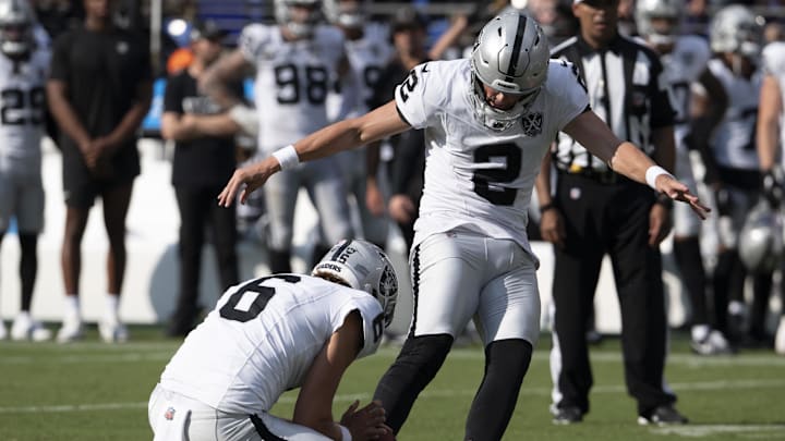 Sep 15, 2024; Baltimore, Maryland, USA; Las Vegas Raiders place kicker Daniel Carlson (2) kicks a game winning field goal  during the second half against the Baltimore Ravens at M&T Bank Stadium. Mandatory Credit: Tommy Gilligan-Imagn Images