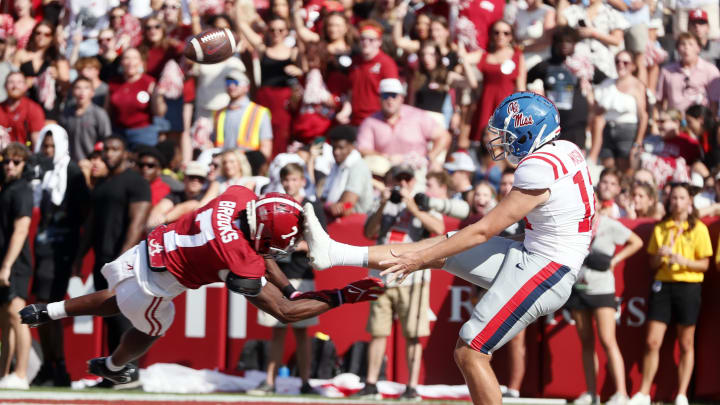 Sep 23, 2023; Tuscaloosa, Alabama, USA;  Alabama Crimson Tide special teams Ja'Corey Brooks (7) blocks a punt by Mississippi Rebels punter Fraser Masin (12) at Bryant-Denny Stadium. Mandatory Credit: Butch Dill-USA TODAY Sports