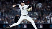 Oct 28, 2024; New York, New York, USA; New York Yankees pitcher Jake Cousins (61) throws during the sixth inning against the Los Angeles Dodgers in game three of the 2024 MLB World Series at Yankee Stadium. Mandatory Credit: Wendell Cruz-Imagn Images